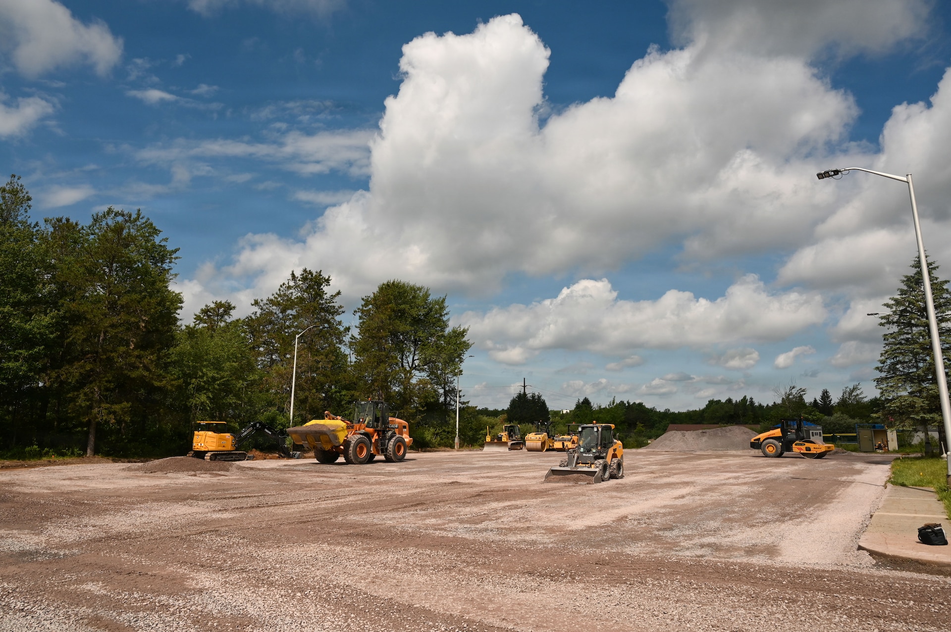 Airmen assigned to the 111th Attack Wing’s 201st RED HORSE Squadron, Detachment 1, operate heavy equipment during a paving project at Tobyhanna Army Depot, Pa., June 17, 2026. The multi-week project provided Airmen hands-on training in pavement construction while supporting infrastructure improvements at the depot. (U.S. Air National Guard photo by Senior Airman Matthew Bergh)