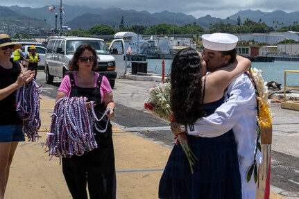 JOINT BASE PEARL HARBOR-HICKAM, Hawaii (July 6, 2026) – Machinist's Mate (Submarines) Auxiliary 2nd Class Enrique Contreras, assigned to Virginia-class fast-attack submarine USS Mississippi (SSN 782), greets his spouse with the traditional first hug as Mississippi returns to its homeport at Joint Base Pearl Harbor-Hickam following deployment, July 6, 2026. Mississippi is assigned to Submarine Squadron 1 and is capable of supporting various missions, including anti-submarine warfare, anti-surface ship warfare, strike warfare, special operations forces support, and intelligence, surveillance, and reconnaissance. (U.S. Navy photo by Sonar Technician Submarines 3rd Class Cannen Tukes)