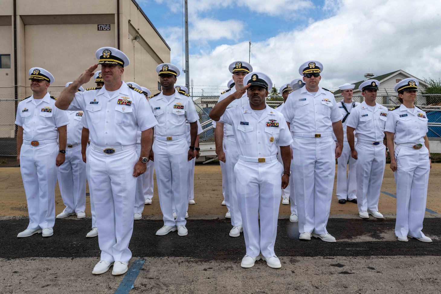 JOINT BASE PEARL HARBOR-HICKAM, Hawaii (July 6, 2026) – Capt. Chris Hedrick, left of center, commodore of Submarine Squadron 1 and Command Master Chief Christopher Kyser, right of center, command master chief, Submarine Squadron 1, salute as Virginia-class fast-attack submarine USS Mississippi (SSN 782) returns to its homeport at Joint Base Pearl Harbor-Hickam following deployment, July 6, 2026. Mississippi is assigned to Submarine Squadron 1 and is capable of supporting various missions, including anti-submarine warfare, anti-surface ship warfare, strike warfare, special operations forces support, and intelligence, surveillance, and reconnaissance. (U.S. Navy photo by Chief Mass Communication Specialist Omar A. Dominquez)