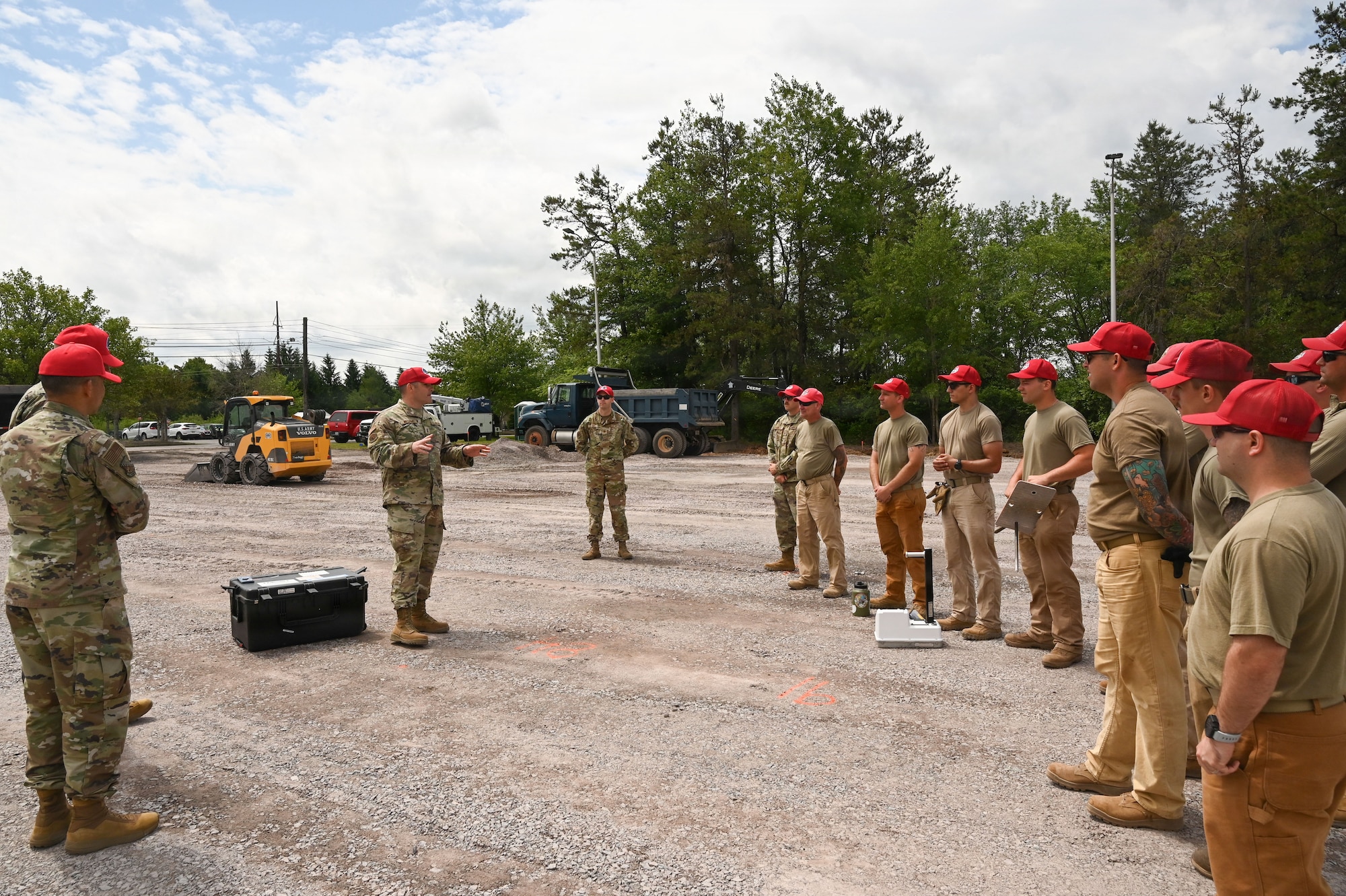 Airmen assigned to the 111th Attack Wing’s 201st RED HORSE Squadron, Detachment 1, receive a project briefing during paving operations at Tobyhanna Army Depot, Pa., June 17, 2026. Airmen worked in rotations throughout the multi-week project, allowing members to gain hands-on experience in pavement construction and heavy equipment operations. (U.S. Air National Guard photo by Senior Airman Matthew Bergh)