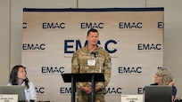 Maj. Court Centore, an Airman in the Florida National Guard, speaks during the EMAC Coordinator and National Guard Workshop in Indianapolis Aug. 12-13.