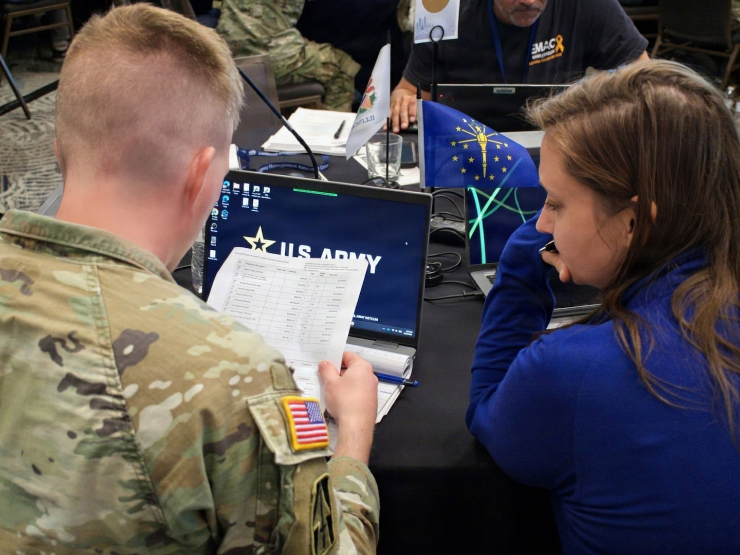 An EMAC coordinator and an Indiana National Guard representative work together during an exercise at the EMAC Coordinator and National Guard Workshop in Indianapolis Aug. 12-13.