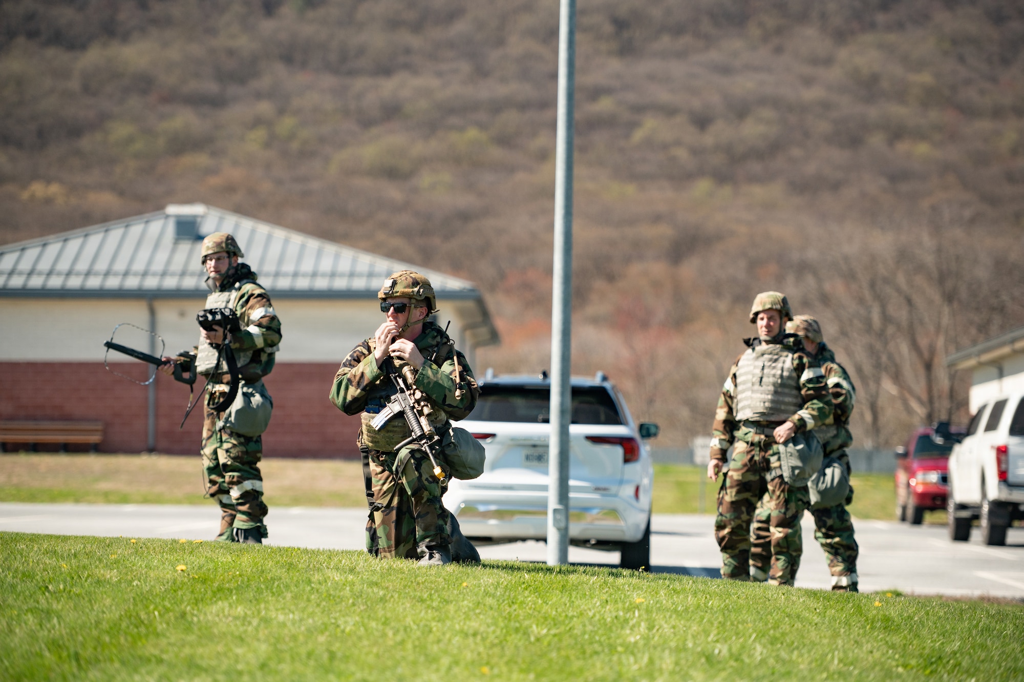 Pennsylvania Air National Guard Airmen assigned to the 111th Attack Wing’s 270th Engineering Installation Squadron conduct radio direction-finding operations alongside security forces during a combat readiness exercise at Fort Indiantown Gap, Pennsylvania, April 11, 2026. The training allowed 270th EIS Airmen to apply their spectrum expertise alongside other mission sets while adapting to evolving exercise scenarios. (U.S. Air National Guard photo by Senior Airman Matthew Bergh)
