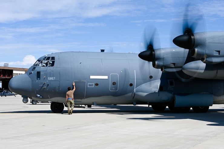 Two Airmen Saluting new commander