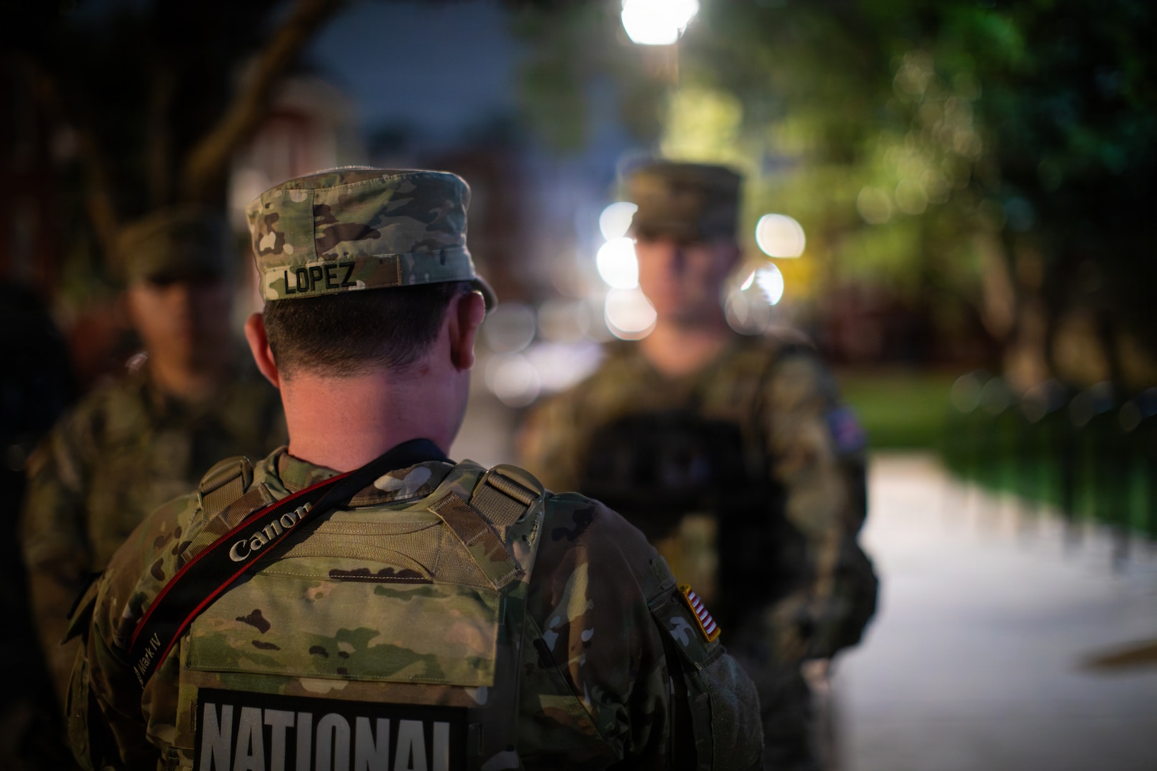 U.S. Army Sgt. Alex Lopez assigned to Joint Task Force-District of Columbia (JTF-DC) in support of the DC Safe and Beautiful mission, interviews a service member near LeDroit Park in Washington, Aug 15, 2026. The service member was apart of a team who days prior had helped return a missing child to their guardian. About 4,500 National Guard members are supporting the mission, providing critical assistance to the Metropolitan Police Department to help ensure the safety of residents, commuters, and visitors throughout the District.
