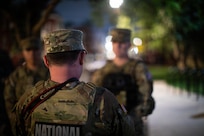 U.S. Army Sgt. Alex Lopez assigned to Joint Task Force-District of Columbia (JTF-DC) in support of the DC Safe and Beautiful mission, interviews a service member near LeDroit Park in Washington, Aug 15, 2026. The service member was apart of a team who days prior had helped return a missing child to their guardian. About 4,500 National Guard members are supporting the mission, providing critical assistance to the Metropolitan Police Department to help ensure the safety of residents, commuters, and visitors throughout the District.