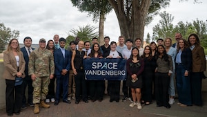 A group of people stand outside