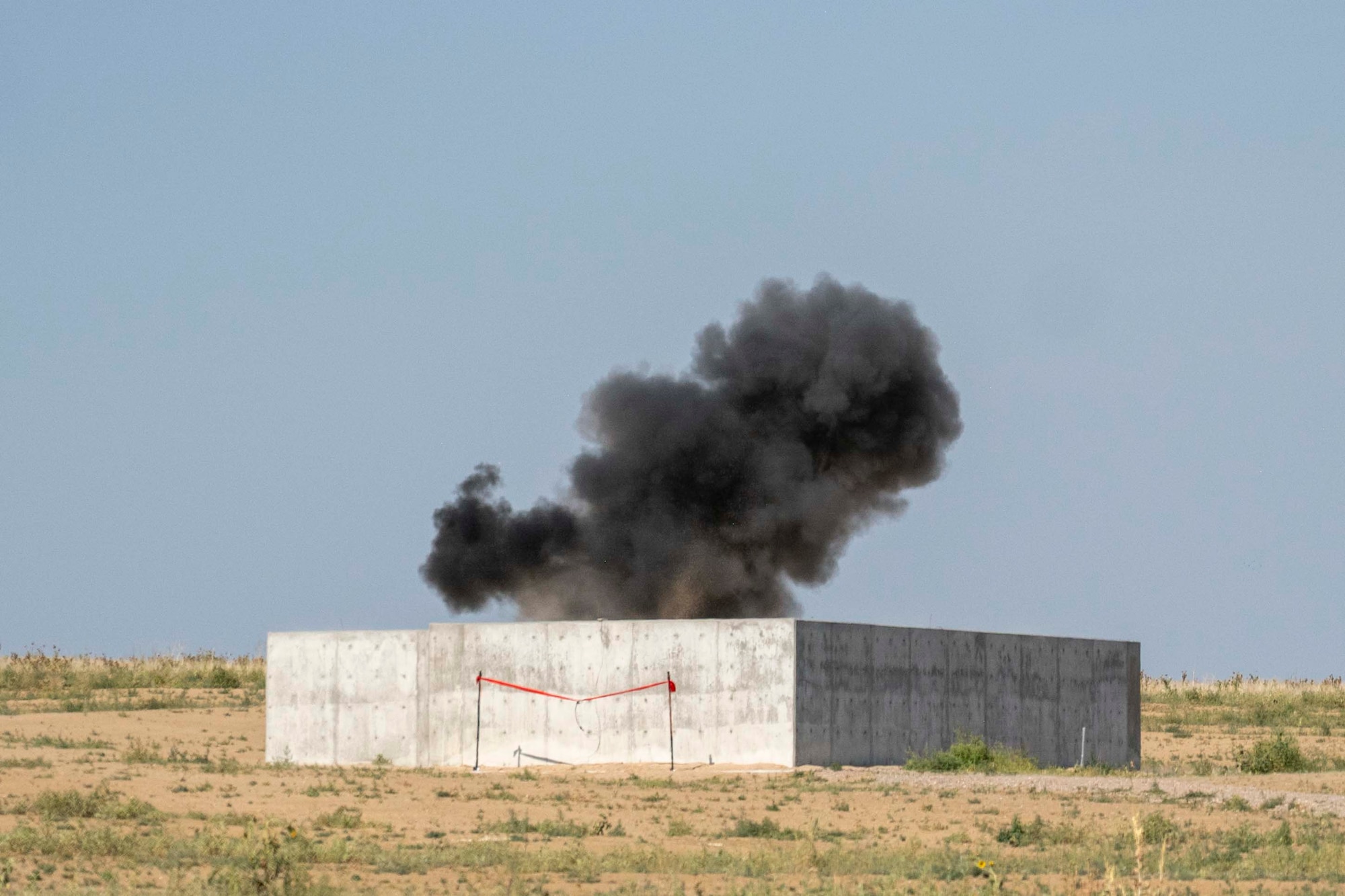 The 140th Explosive Ordnance Disposal Flight celebrates a ribbon cutting of a new facility at Buckley Space Force Base, Aurora, Colorado, by demonstrating a set of detonations, July 2, 2026. The new proficiency range will allow the 140th EOD to complete their monthly qualifications and much of their annual qualifications locally while expanding their relationships with local bomb squads, federal entities, and regional EOD units.
(U.S. Air National Guard photo by Tech. Sgt. Chance Johnson)