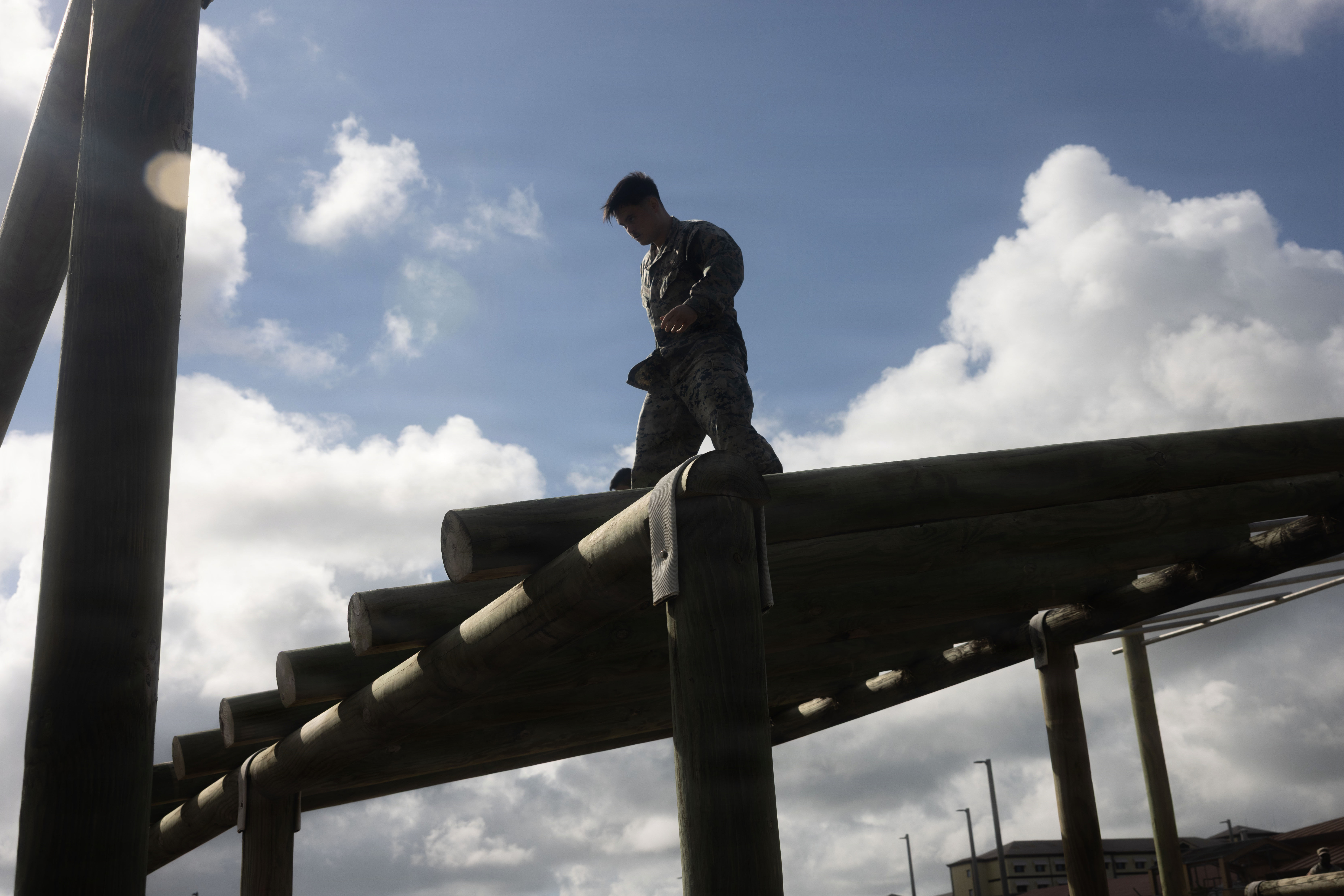 U.S. Marine Corps Cpl. Rey Moreno Marilao, combat videographer, Headquarters Company, Marine Corps Base Camp Blaz, participates in the obstacle course on MCB Camp Blaz, Guam, Aug. 14, 2026. The Marine Corps obstacle course tests Marine’s strength, endurance, and mental toughness through a series of physically demanding challenges. (U.S. Marine Corps photo by Lance Cpl. Afton Smiley)