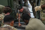 Pennsylvania and Texas Air National Guardsmen assigned to the 111th Attack Wing and the 149th Fighter Wing, work together to set up a Expandable Single Pallet Expeditionary Kitchen (E-SPEK) during a joint training at Biddle Air National Guard Base, Horsham, Pennsylvania, Aug. 17, 2026. The purpose of this training was to complete training required every 24 months, to ensure deployment readiness, and to work together with other wings. (Pennsylvania Air National Guard photo by Staff Sgt. Charles Casner)