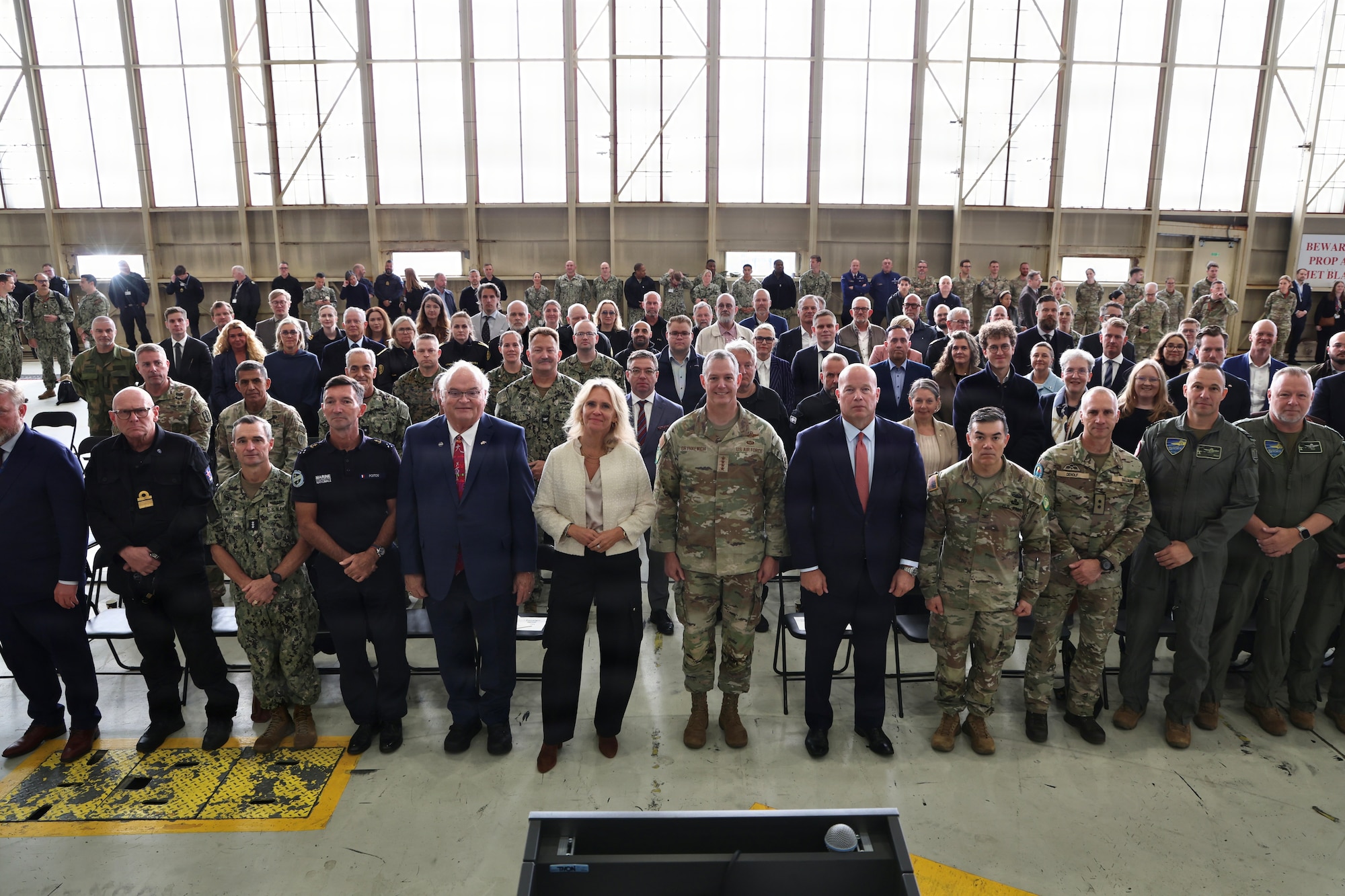 Þorgerður Katrín Gunnarsdóttir, Minister for Foreign Affairs of Iceland, center left, U.S. Air Force Gen. Alexus G. Grynkewich, NATO Supreme Allied Commander Europe, commander of U.S European Command, center right, and distinguished guest pose for a group photo during the opening ceremony of exercise Northern Viking 26 (NV26) at Keflavik Air Base, Iceland