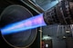 An Aircraft engine runs at full after burner in a test cell.