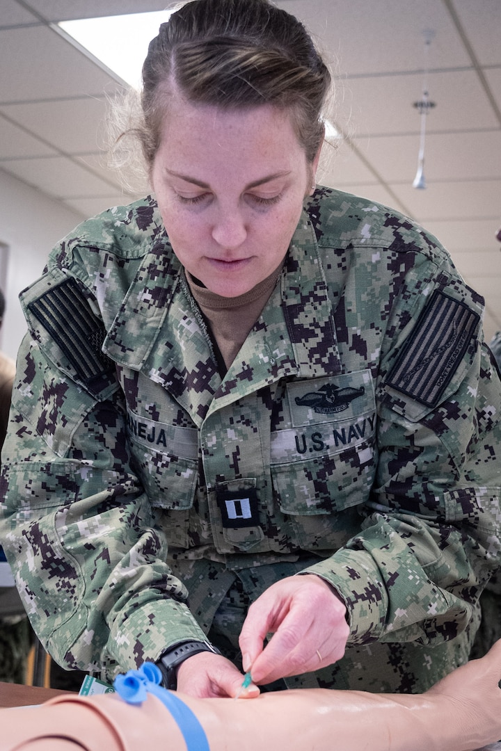 *Training*  Navy Lt. Jessica Maneja trains to insert an IV needle in a training aid during a skills fair conducted Thursday, August 20, 2026, at Navy Medicine Readiness and Training Command Cherry Point.  The Skills Fair evaluated the knowledge of corpsmen assigned to the facility and trained them on competencies and tasks expected of them in an operational environment.