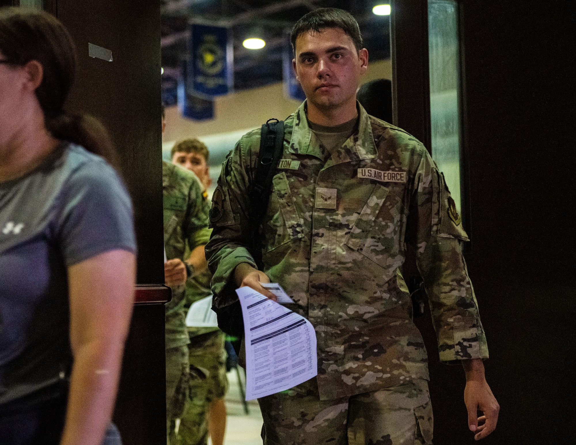 U.S. Airman 1st Class Matthew Touchton, public health emergency exercise participant, moves through a patient processing area.