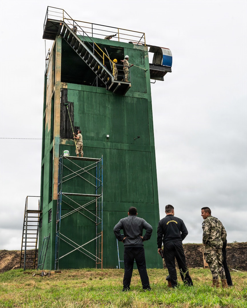 Members of the Massachusetts National Guard paint a sniper tower at the Escuela de Infantería (School of Infantry) in Remansito, Paraguay, July 23, 2026.
