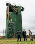 Members of the Massachusetts National Guard paint a sniper tower at the Escuela de Infantería (School of Infantry) in Remansito, Paraguay, July 23, 2026.