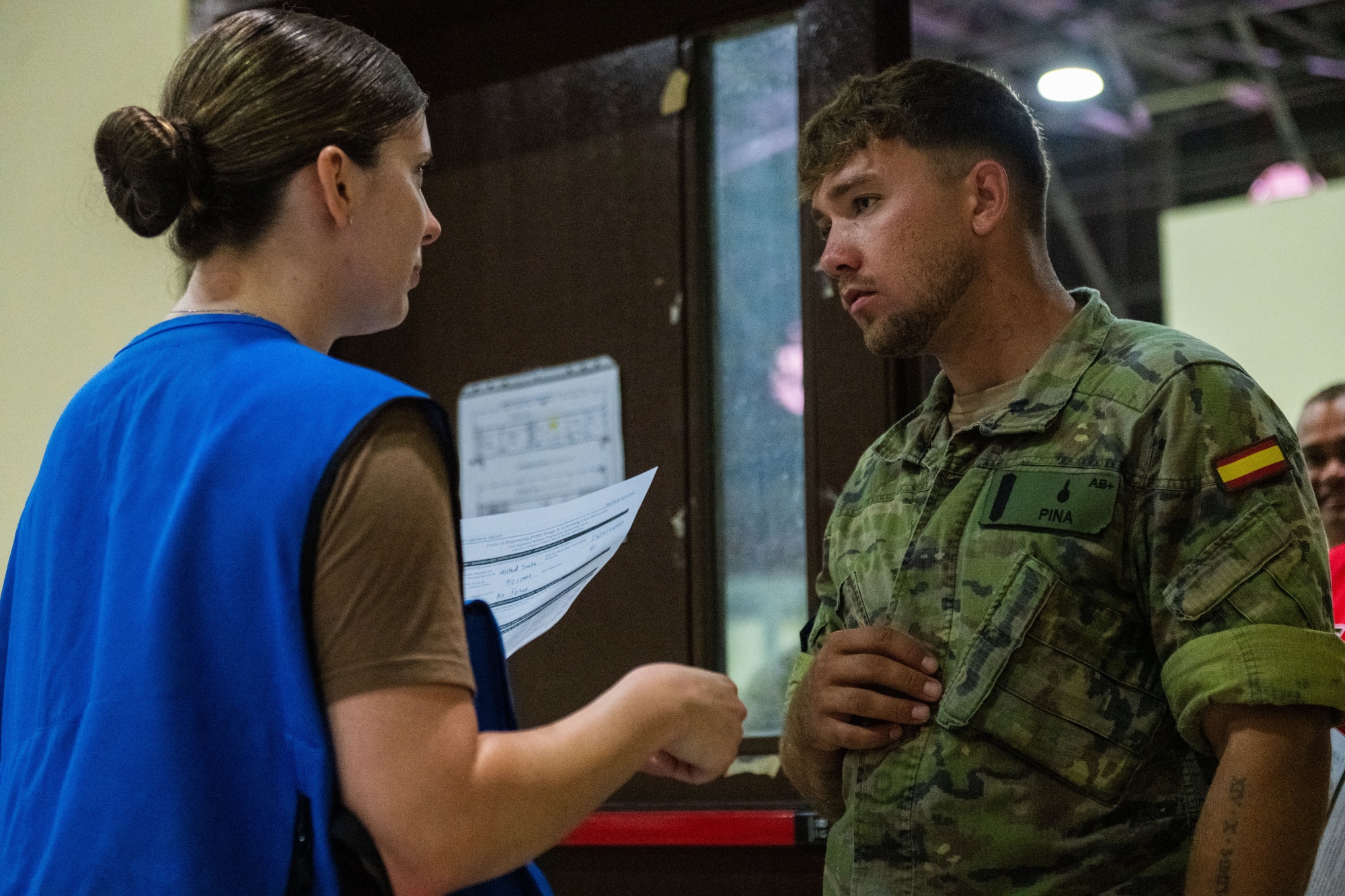 A U.S. Airman assigned to the 39th Medical Group, left, speaks with a Spanish soldier assigned to the Spanish Patriot Unit.