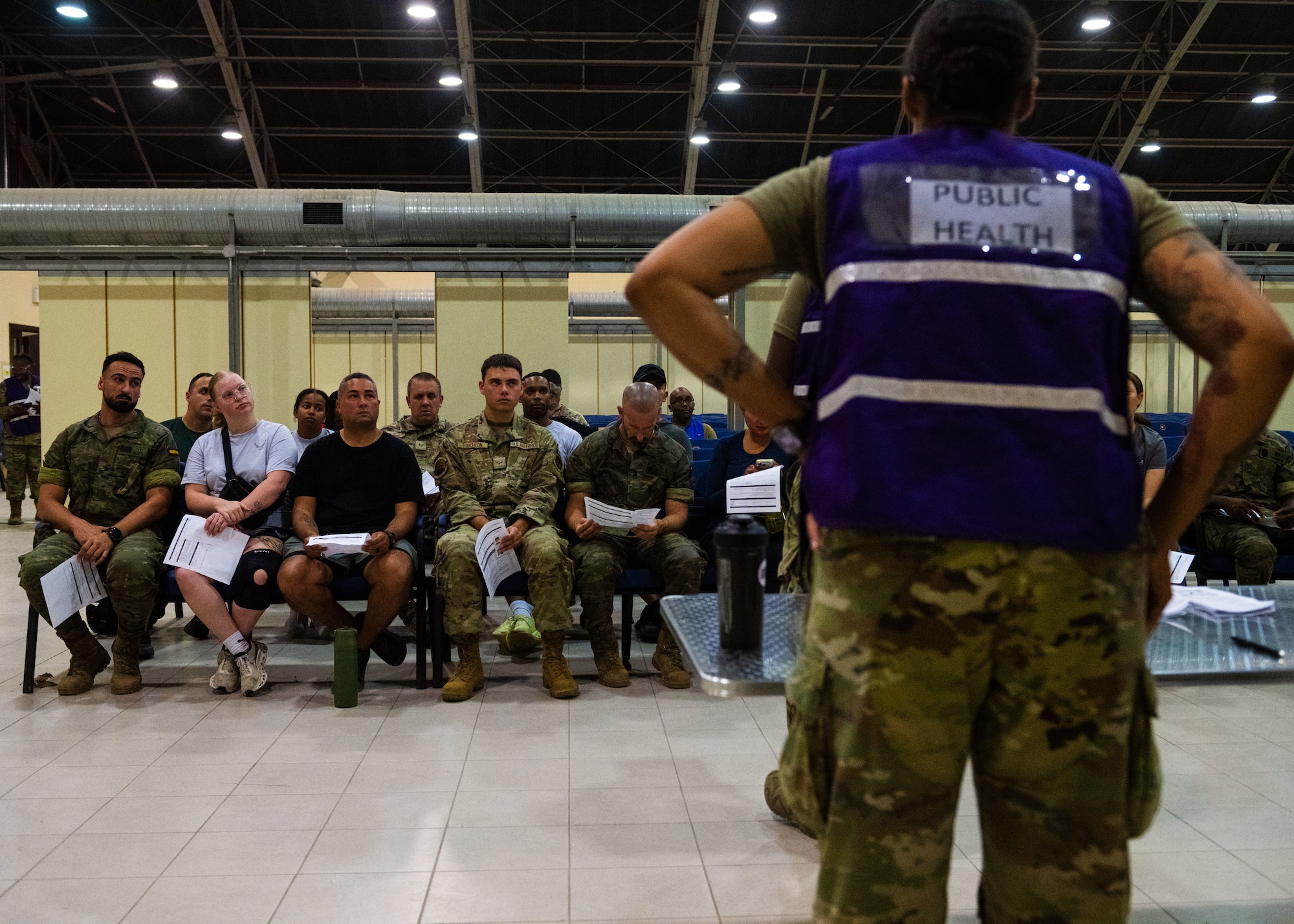 A U.S. Airman assigned to the 39th Medical Group briefs U.S. and Spanish personnel.
