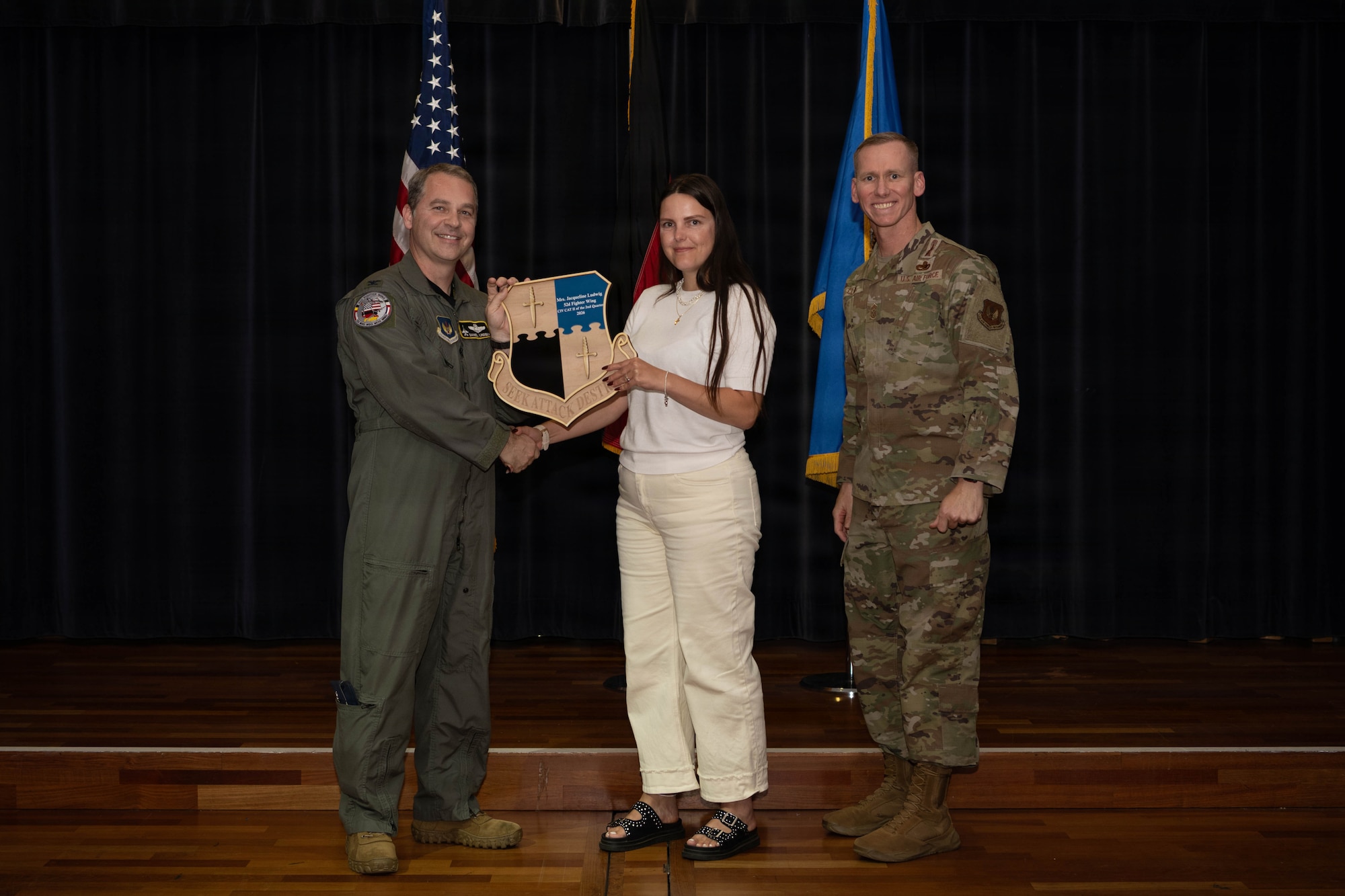 Person receives award.