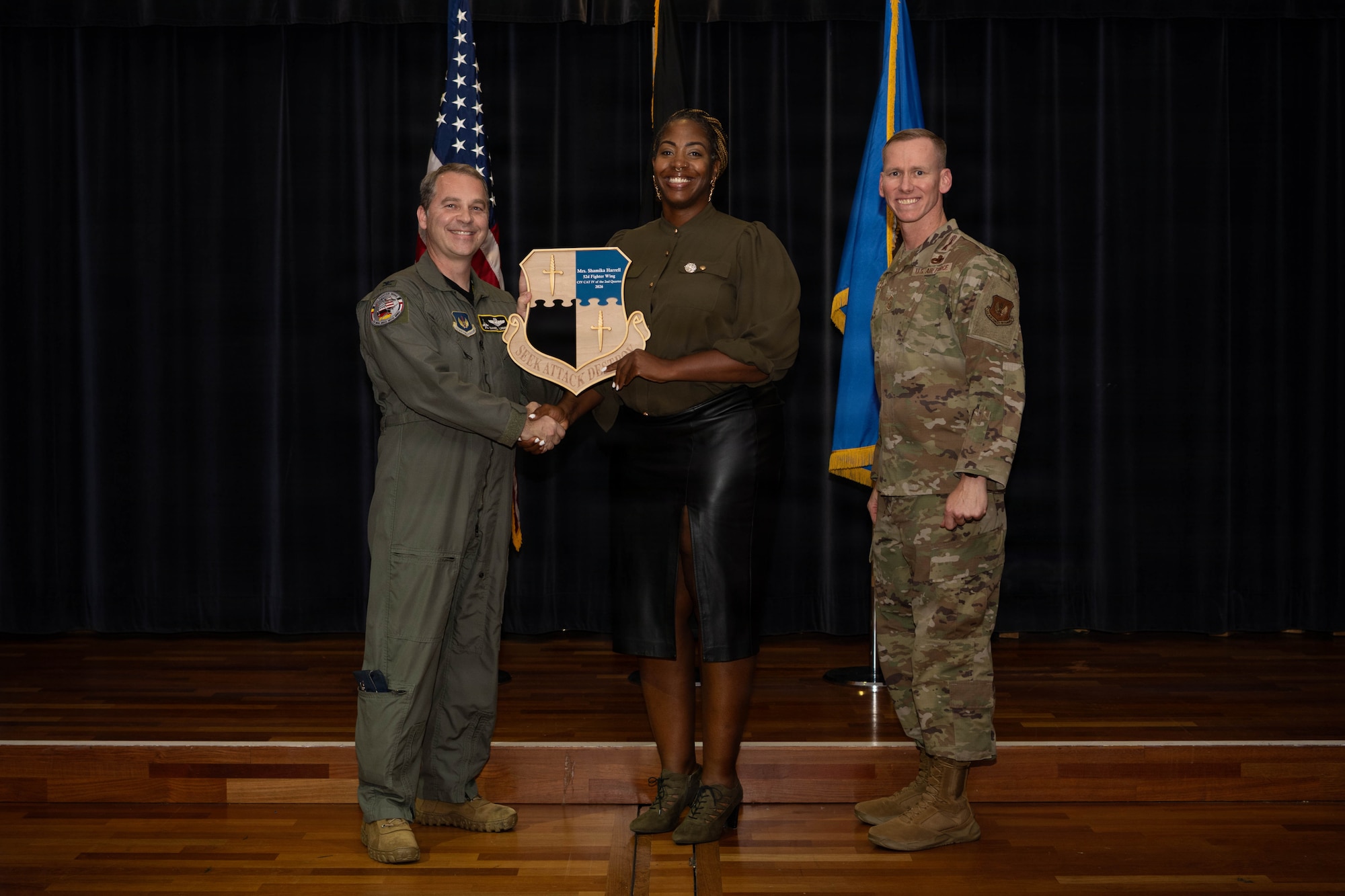 Person receives award.
