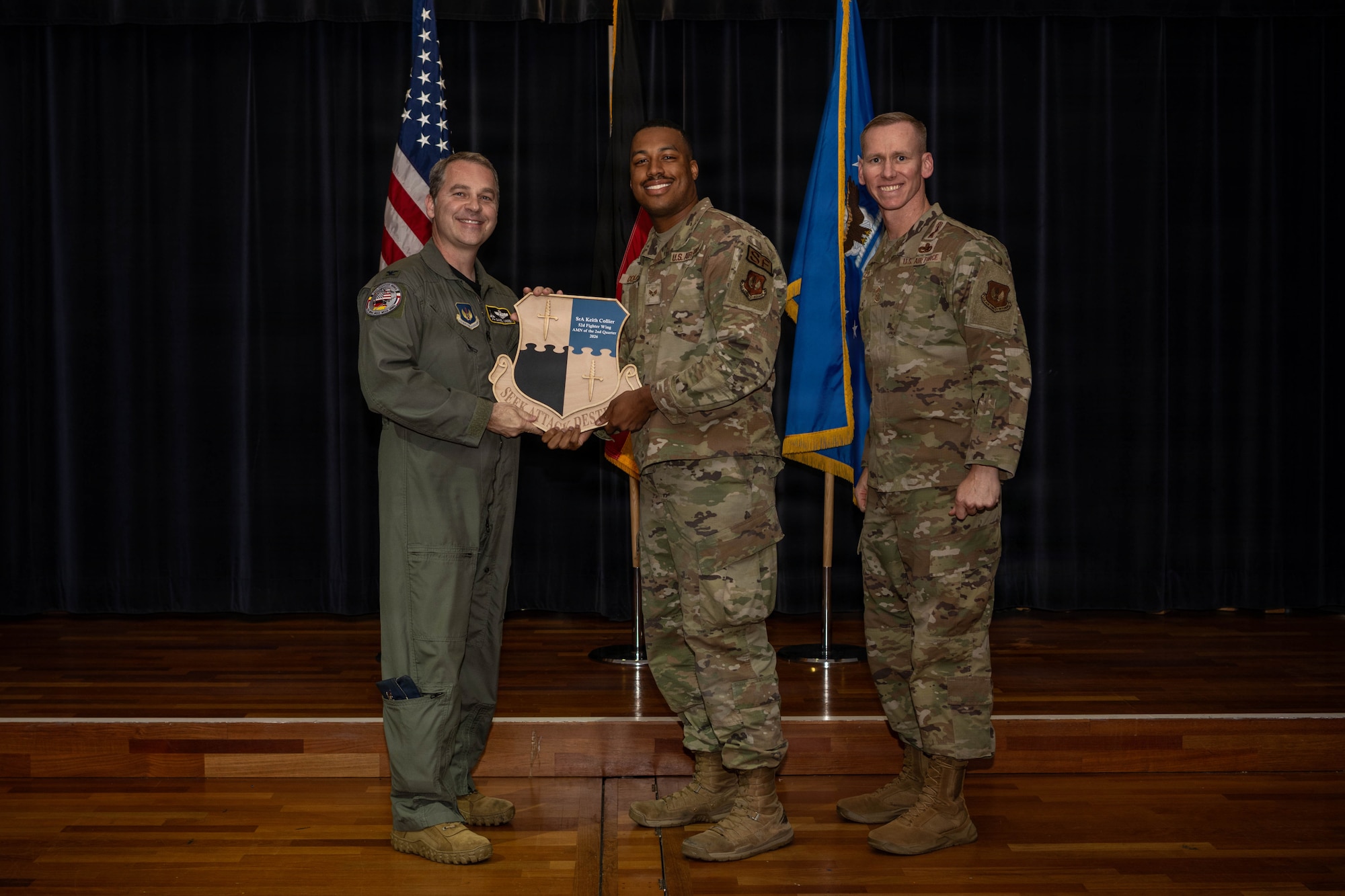 Person receives award.