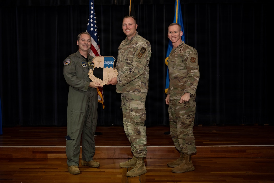 Person receives award.