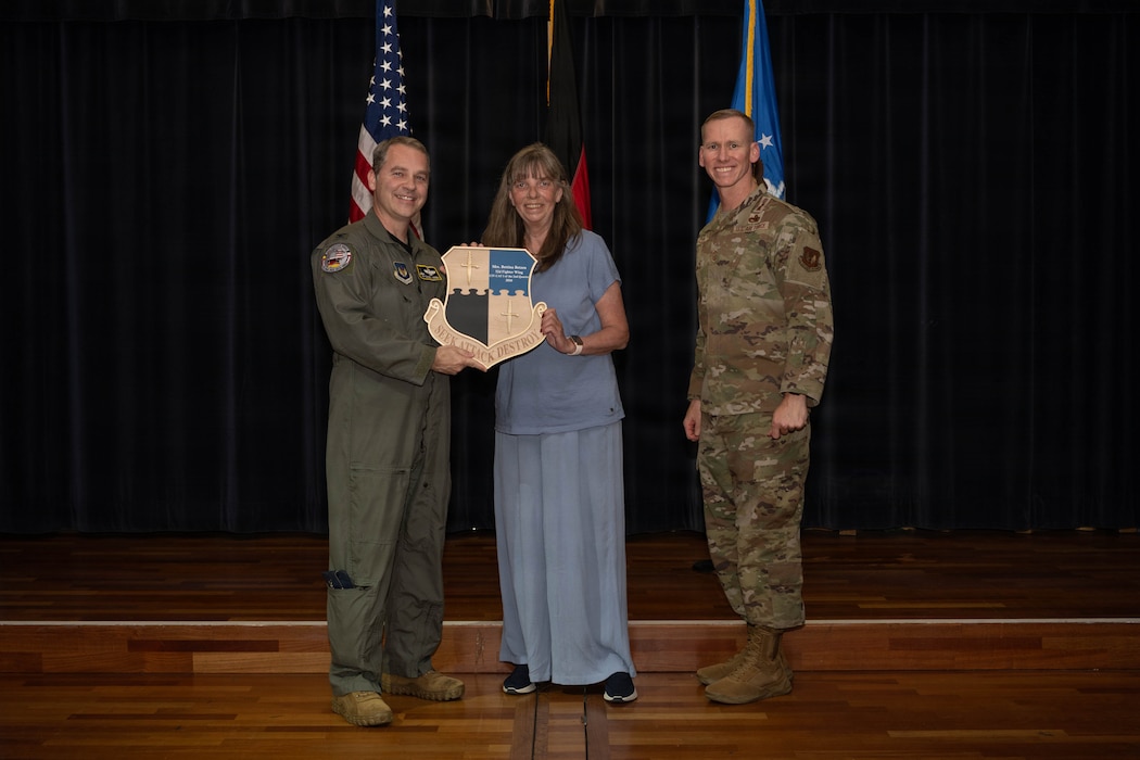 Person receives award.