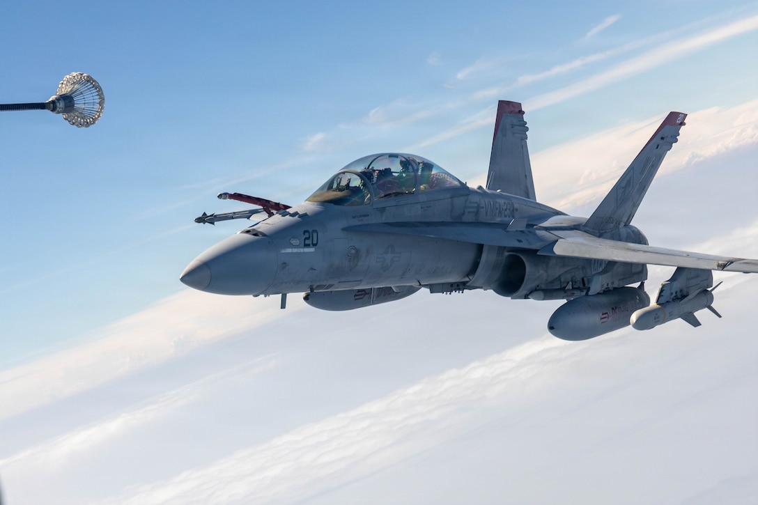 A U.S. Marine Corps KC-130J Super Hercules aircraft with Marine Aerial Refueler Transport Squadron (VMGR) 152, prepares to refuel an F/A-18D Hornet aircraft with Marine Fighter Attack Squadron (VMFA) 232, both assigned to Marine Aircraft Group 12, 1st Marine Aircraft Wing, off the coast of Japan, Aug, 19, 2026. U.S. Marines with Marine Aerial Refueler Transport Squadron 152 conduct aerial refueling operations in support of Marine Fighter Attack Squadron 232, demonstrating the Marine Corps’ ability to sustain and generate combat airpower. (U.S. Marine Corps photo by Lance Cpl. David Getz)