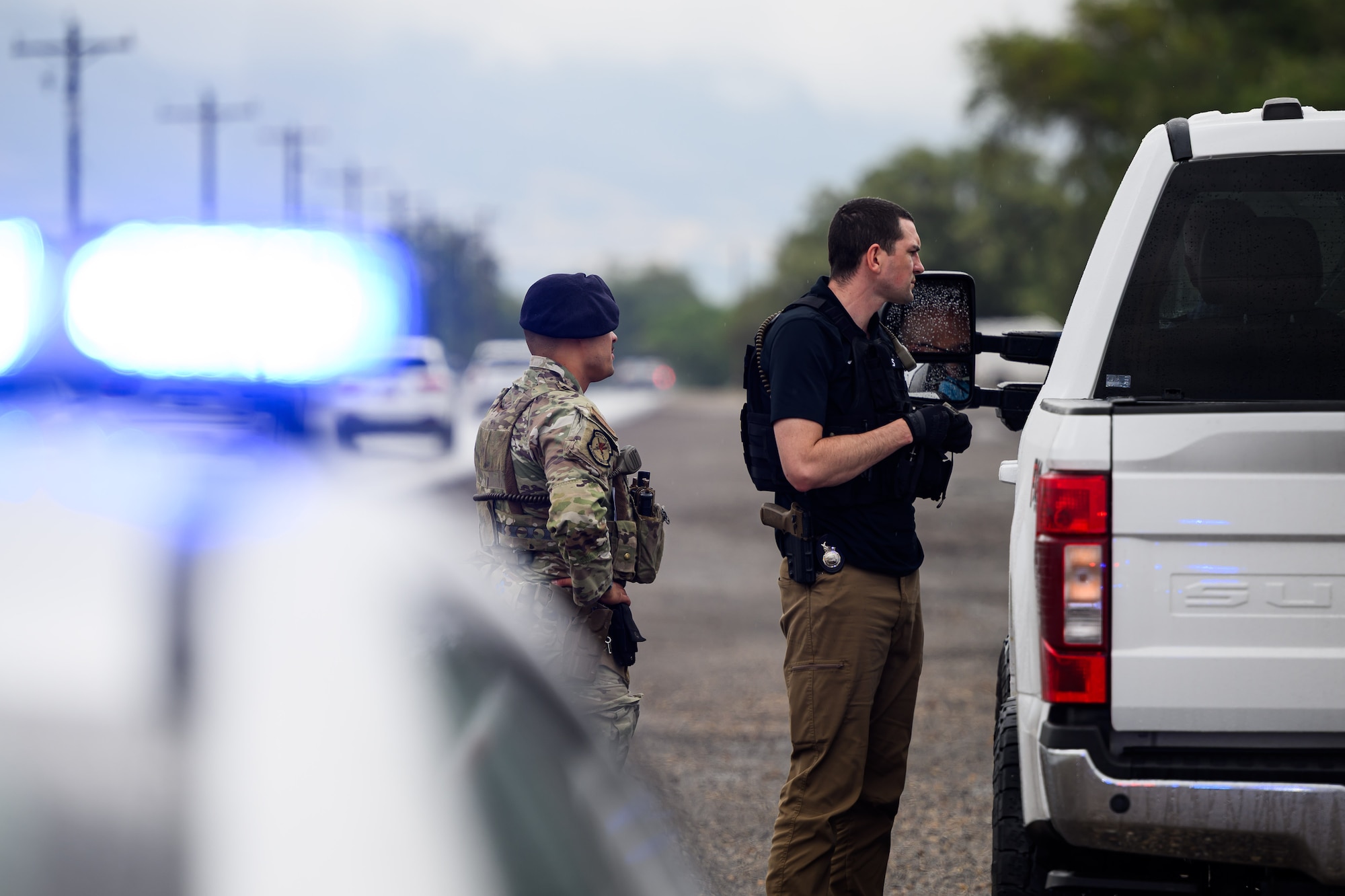 75th Security Forces Squadron defenders conduct a traffic stop during a speed enforcement operation.