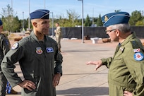 U.S. Air Force Gen. Adrian Spain, commander of Air Combat Command, left, speaks with Royal Canadian Air Force Lt. Gen. Iain Huddleston, deputy commander of North American Aerospace Defense Command (NORAD), outside of the NORAD and U.S. Northern Command (USNORTHCOM) headquarters on Peterson Space Force Base, Colorado, Aug. 18, 2026. The commanders met to begin the annual Warfighter Talks, an executive-level engagement between NORAD and USNORTHCOM, and ACC, focused on synchronizing force presentation, modernizing command and control systems, and enhancing combined readiness to defend North America. (Dept. of War photo by U.S. Air Force Staff Sgt. Colten Tessness)