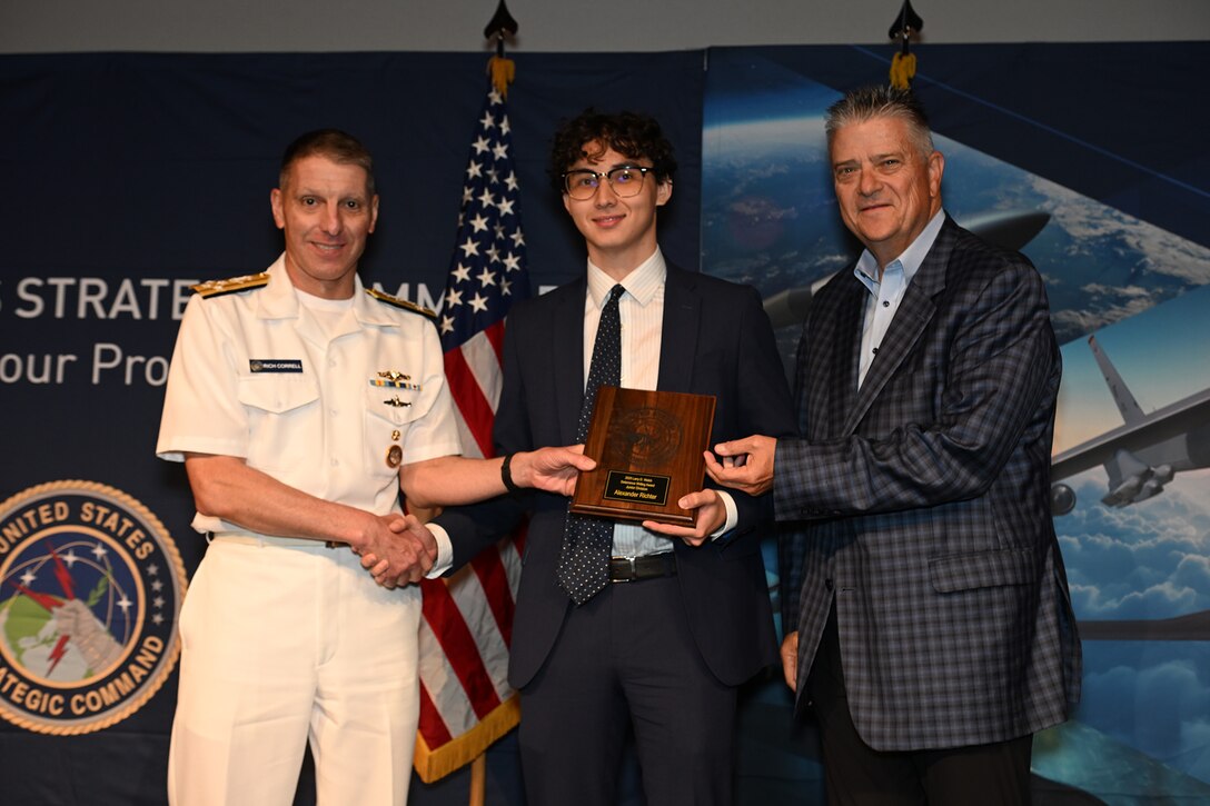 INSS Research Intern Alex Richter receiving the Larry D. Welch deterrence writing award from U.S. Strategic Command Commander Admiral Richard Corral at the STRATCOM Deterrence Symposium in Omaha, Nebraska on August 5, 2026