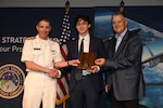 INSS Research Intern Alex Richter receiving the Larry D. Welch deterrence writing award from U.S. Strategic Command Commander Admiral Richard Corral at the STRATCOM Deterrence Symposium in Omaha, Nebraska on August 5, 2026