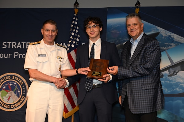 INSS Research Intern Alex Richter receiving the Larry D. Welch deterrence writing award from U.S. Strategic Command Commander Admiral Richard Corral at the STRATCOM Deterrence Symposium in Omaha, Nebraska on August 5, 2026