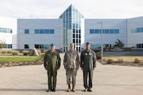 Gen. Gregory Guillot, center, commander of the North American Aerospace Defense Command (NORAD) and U.S. Northern Command (USNORTHCOM), Royal Canadian Air Force Lt. Gen. Iain Huddleston, deputy commander of NORAD, and U.S. Air Force Gen. Adrian Spain, commander of Air Combat Command, pose for a photo at NORAD and USNORTHCOM headquarters on Peterson Space Force Base, Colorado, Aug. 18, 2026. The commanders met to begin the annual Warfighter Talks, an executive-level engagement focused on synchronizing force presentation, modernizing command and control systems, and enhancing combined readiness to defend North America. (Dept. of War photo by U.S. Air Force Staff Sgt. Colten Tessness)