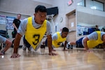 U.S. Air Force Airman Basic Kenneth Roiles, 12th Training Squadron student, performs pushups during a mock physical fitness test on Joint Base San Antonio-Randolph, Texas, Aug. 4, 2026. Students at the 12th FTS face monthly physical training assessments to ensure they maintain the baseline fitness standards for U.S. Air Force members. (U.S. Air Force Photo by Airman 1st Class Kevin Prashad)