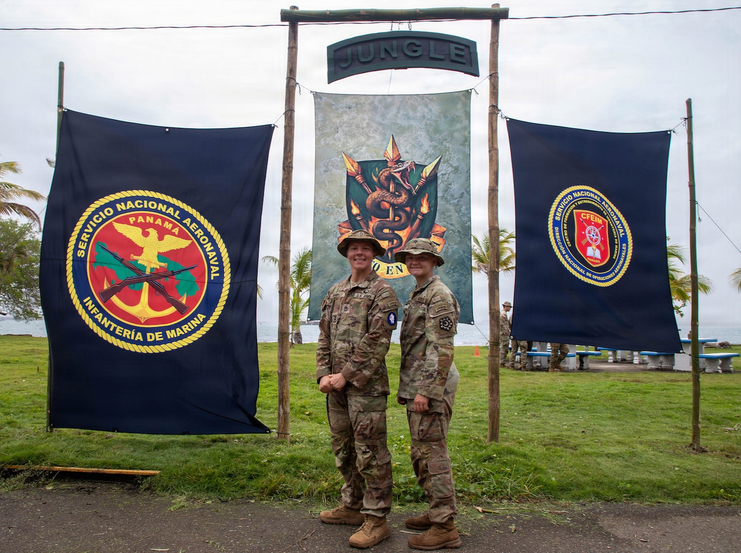U.S. Army Sgt. 1st Class Gabrielle Hamelly and Spc. Aurora Pennington pose for a photo at Aeronaval Base Cristóbal Colón, Panama, July 3.