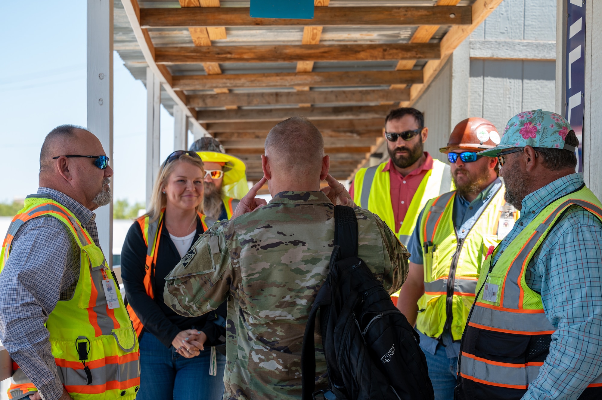 U.S. Army Lt. Gen. William H. “Butch” Graham Jr., 56th Chief of Engineers and U.S. Army Corps of Engineers commanding general, engages with USACE personnel during a visit to Dyess Air Force Base, Texas, Aug. 18, 2026. The visit provided Graham an opportunity to view mission-supporting infrastructure and discuss construction and operational coordination requirements for the B-21 Raider beddown. (U.S. Air Force photo by Airman 1st Class William Neal) This photo was altered for security purposes by blurring out identification badges.