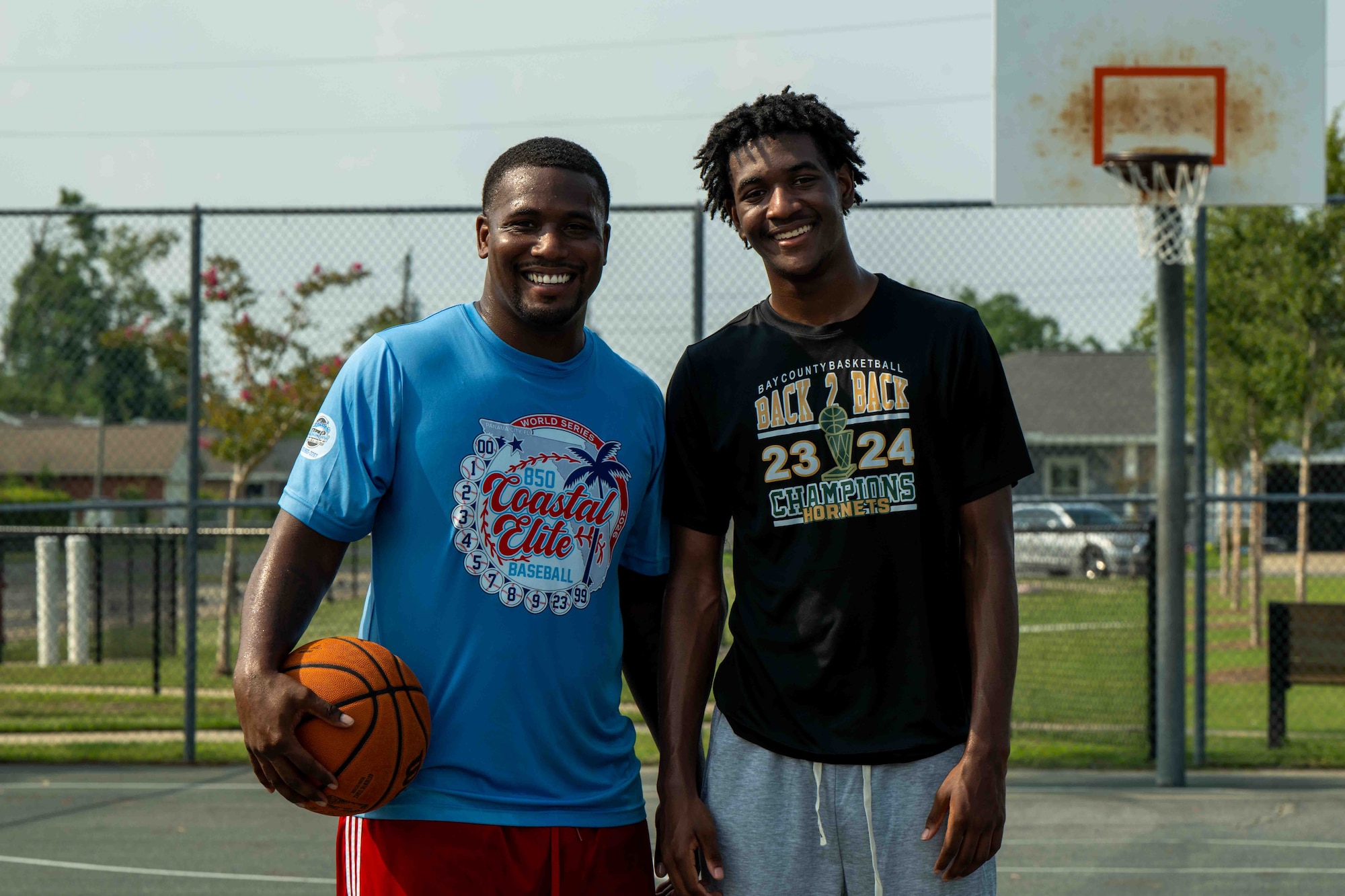 U.S. Air Force Senior Airman Vicen’te Thompkins, 337th Air Control Squadron weapons simulation technician, poses with his mentee, JT, in Panama City, Florida, July 29, 2026.
