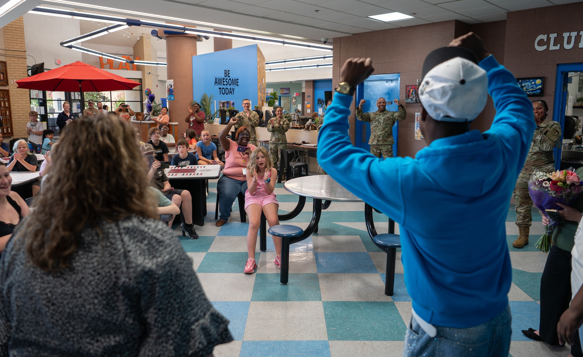 Youth celebrates with others