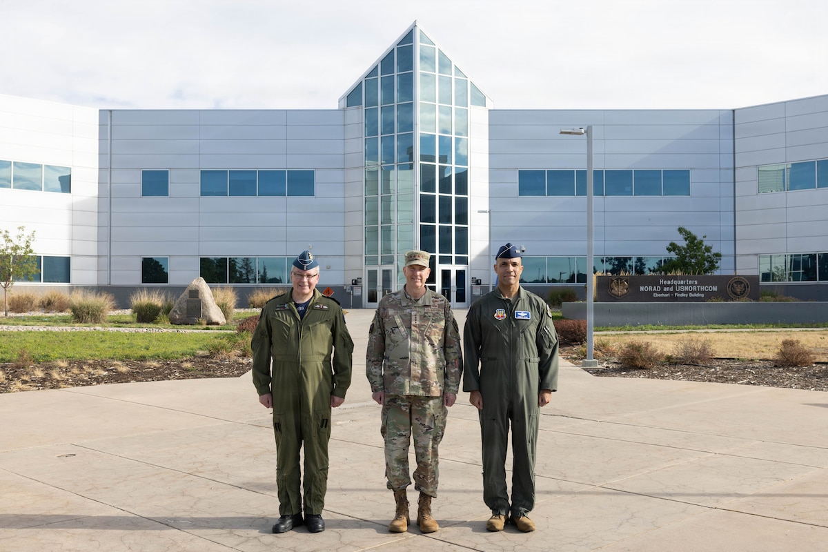 Gen. Gregory Guillot, center, commander of the North American Aerospace Defense Command (NORAD) and U.S. Northern Command (USNORTHCOM), Royal Canadian Air Force Lt. Gen. Iain Huddleston, deputy commander of NORAD, and U.S. Air Force Gen. Adrian Spain, commander of Air Combat Command, pose for a photo at NORAD and USNORTHCOM headquarters on Peterson Space Force Base, Colorado, Aug. 18, 2026. The commanders met to begin the annual Warfighter Talks, an executive-level engagement focused on synchronizing force presentation, modernizing command and control systems, and enhancing combined readiness to defend North America. (Dept. of War photo by U.S. Air Force Staff Sgt. Colten Tessness)