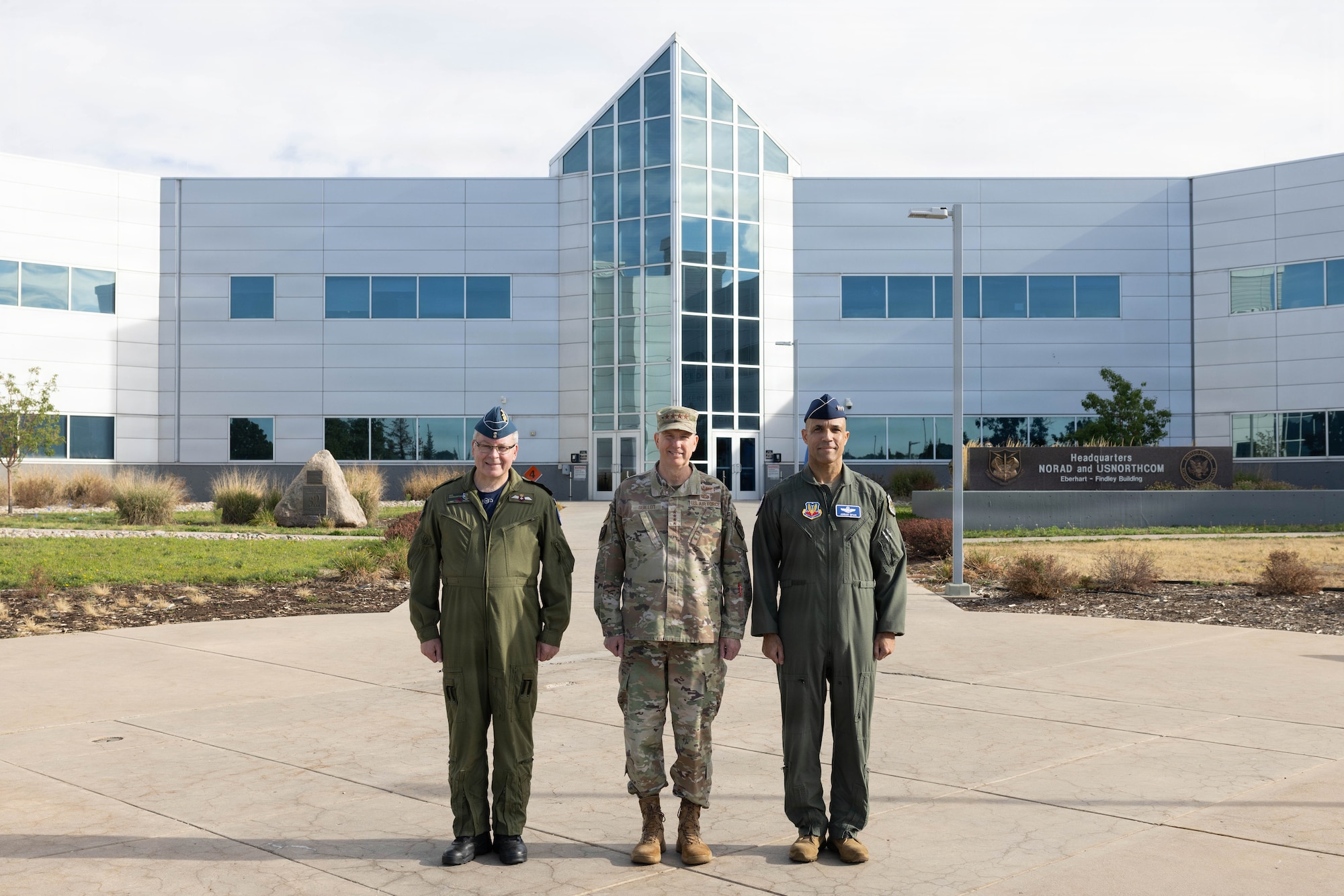 Gen. Gregory Guillot, center, commander of the North American Aerospace Defense Command (NORAD) and U.S. Northern Command (USNORTHCOM), Royal Canadian Air Force Lt. Gen. Iain Huddleston, deputy commander of NORAD, and U.S. Air Force Gen. Adrian Spain, commander of Air Combat Command, pose for a photo at NORAD and USNORTHCOM headquarters on Peterson Space Force Base, Colorado, Aug. 18, 2026. The commanders met to begin the annual Warfighter Talks, an executive-level engagement focused on synchronizing force presentation, modernizing command and control systems, and enhancing combined readiness to defend North America. (Dept. of War photo by U.S. Air Force Staff Sgt. Colten Tessness)