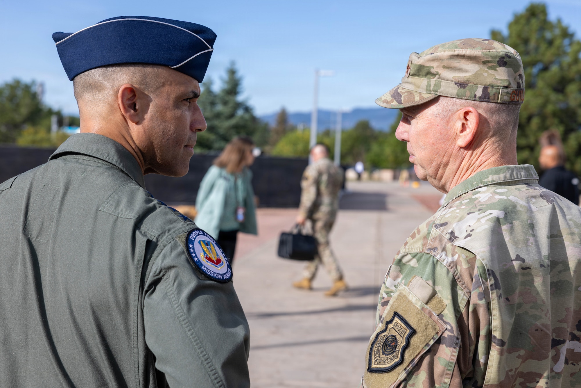 Gen. Gregory Guillot, commander of North American Aerospace Defense Command (NORAD) and U.S. Northern Command (USNORTHCOM), speaks with Gen. Adrian Spain, commander of Air Combat Command, outside of the NORAD and USNORTHCOM headquarters on Peterson Space Force Base.