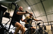 People using stationary bikes