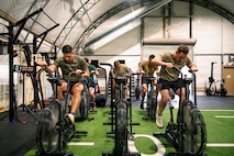 People using stationary bikes