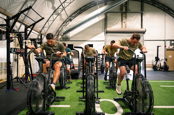 People using stationary bikes