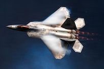 An F-22 Raptor assigned to the F-22 Raptor Demonstration Team flies past pyrotechnic smoke during the Arctic Thunder Open House at Joint Base Elmendorf-Richardson, Alaska, Aug. 8, 2026. The F-22 is the Air Force’s premier fifth-generation fighter, combining stealth, supercruise and advanced sensor capabilities. (U.S. Air Force photo by Airman 1st Class Theodore Gowdy)