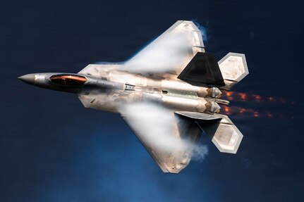 An F-22 Raptor assigned to the F-22 Raptor Demonstration Team flies past pyrotechnic smoke during the Arctic Thunder Open House at Joint Base Elmendorf-Richardson, Alaska, Aug. 8, 2026. The F-22 is the Air Force’s premier fifth-generation fighter, combining stealth, supercruise and advanced sensor capabilities. (U.S. Air Force photo by Airman 1st Class Theodore Gowdy)