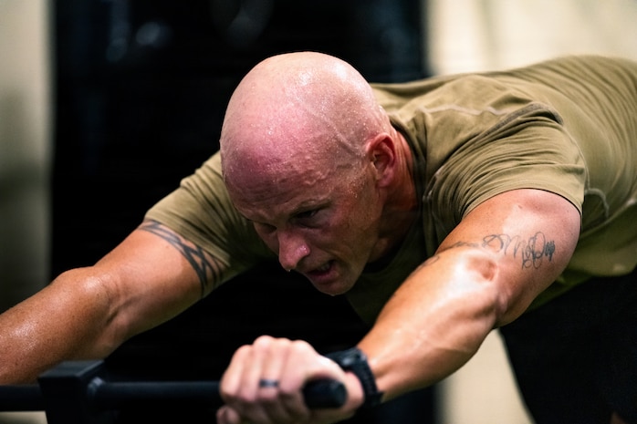 Person pushes weight sled