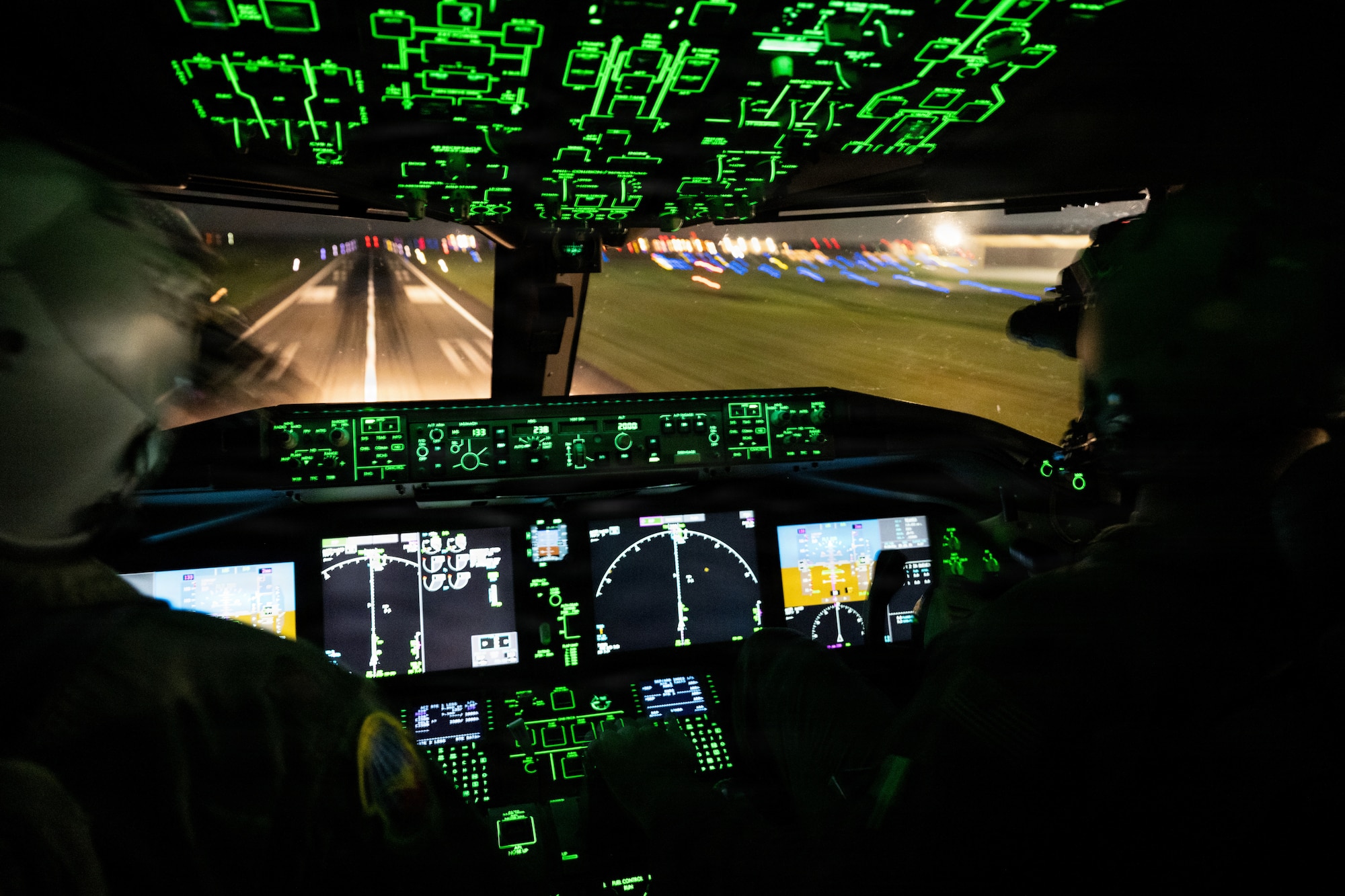 U.S. Air Force Nicholaus Herr, 32nd Air Refueling Squadron pilot, and Maj. Cameron Sperry, 2nd Aerial Refueling Squadron pilot, use night vision goggles to land a KC-46A Pegasus aircraft at Joint Base McGuire-Dix-Lakehurst, N.J., July 30, 2026.