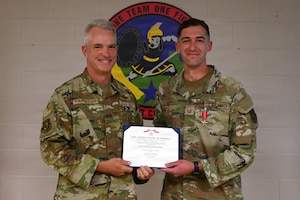 U.S. Air Force Brig. Gen. Darren Hamilton, Ohio National Guard chief of staff, presents the Bronze Star Medal to Master Sgt. Daniel Rogers, an air battle manager asigned to the 123rd Air Control Squadron, during a ceremony Aug. 1, 2026 at Blue Ash Air National Guard Station. The Bronze Star Medal recognizes individuals who, while serving in a combat theater, distinguish themselves by heroic achievement or heroic service. (U.S. Air National Guard photo by Shane Hughes)